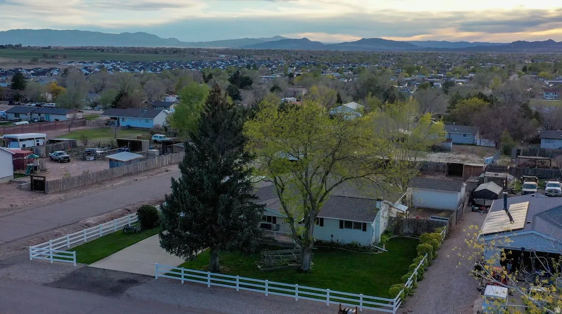 Aerial view of residential area with a mountainous background