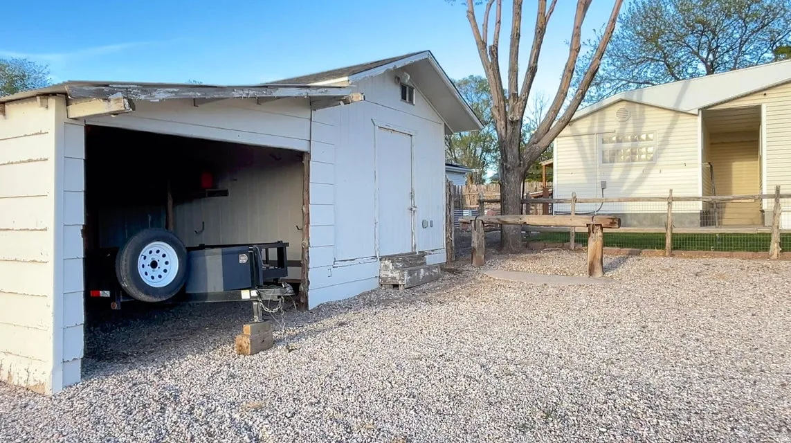 View of outbuilding with a garage