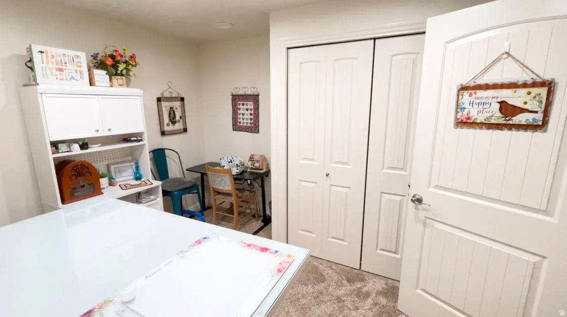Bedroom featuring a closet and light carpet