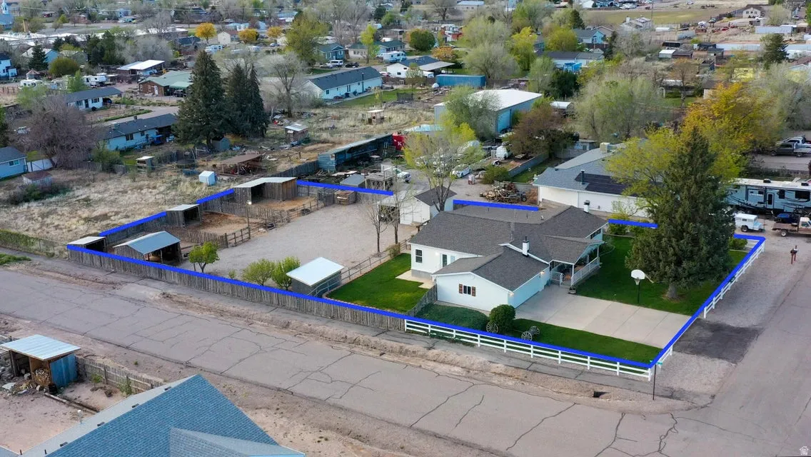 Aerial perspective of suburban area featuring property parcel outlined