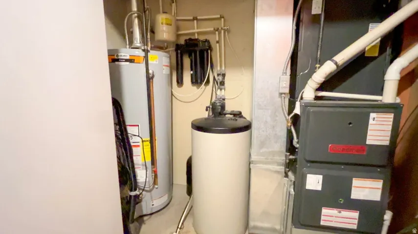 Utilities featuring heating unit and water heater