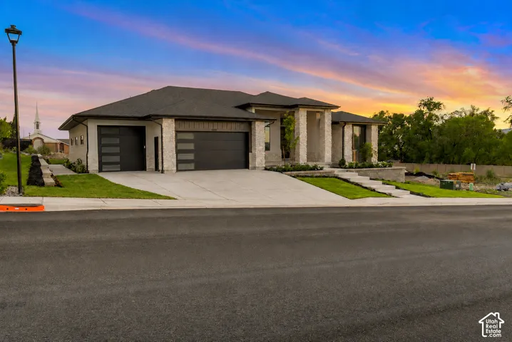 Modern facade featuring stone accents and stucco siding