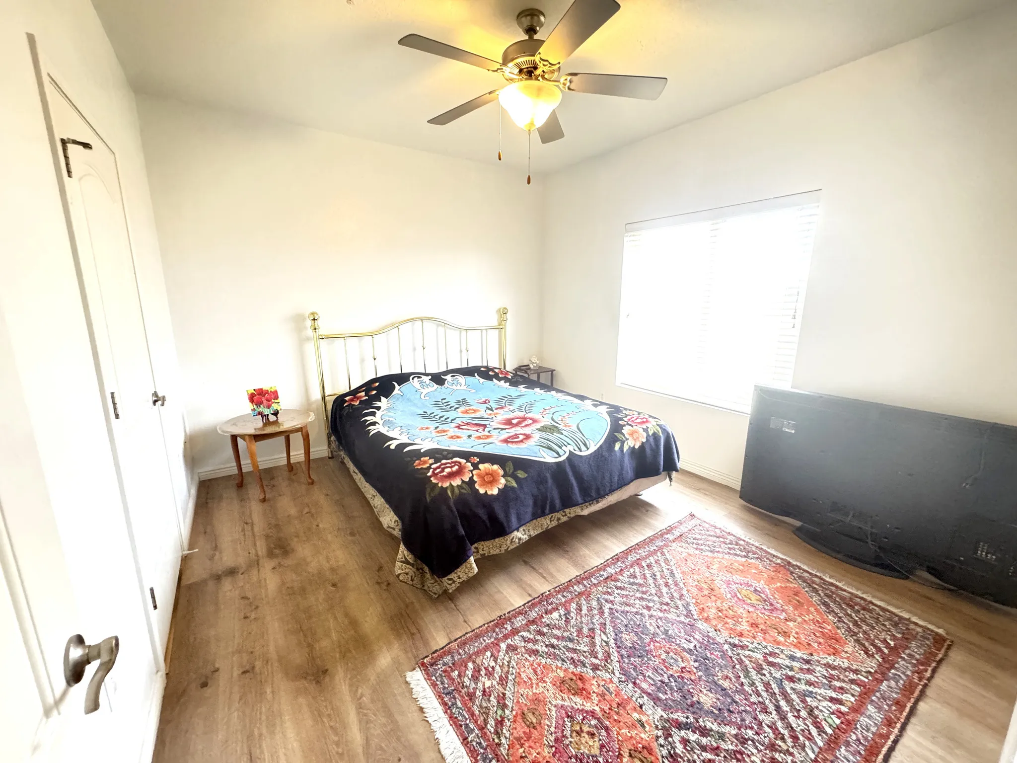 Bedroom featuring light wood finished floors and a ceiling fan