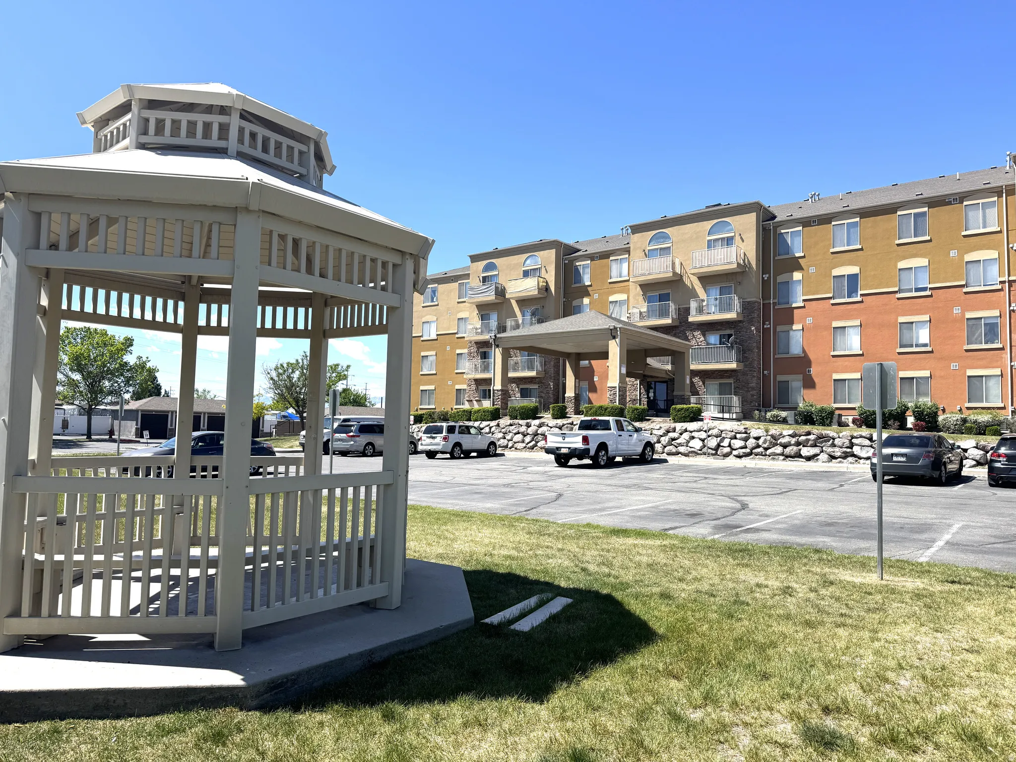 Surrounding community with uncovered parking and a gazebo
