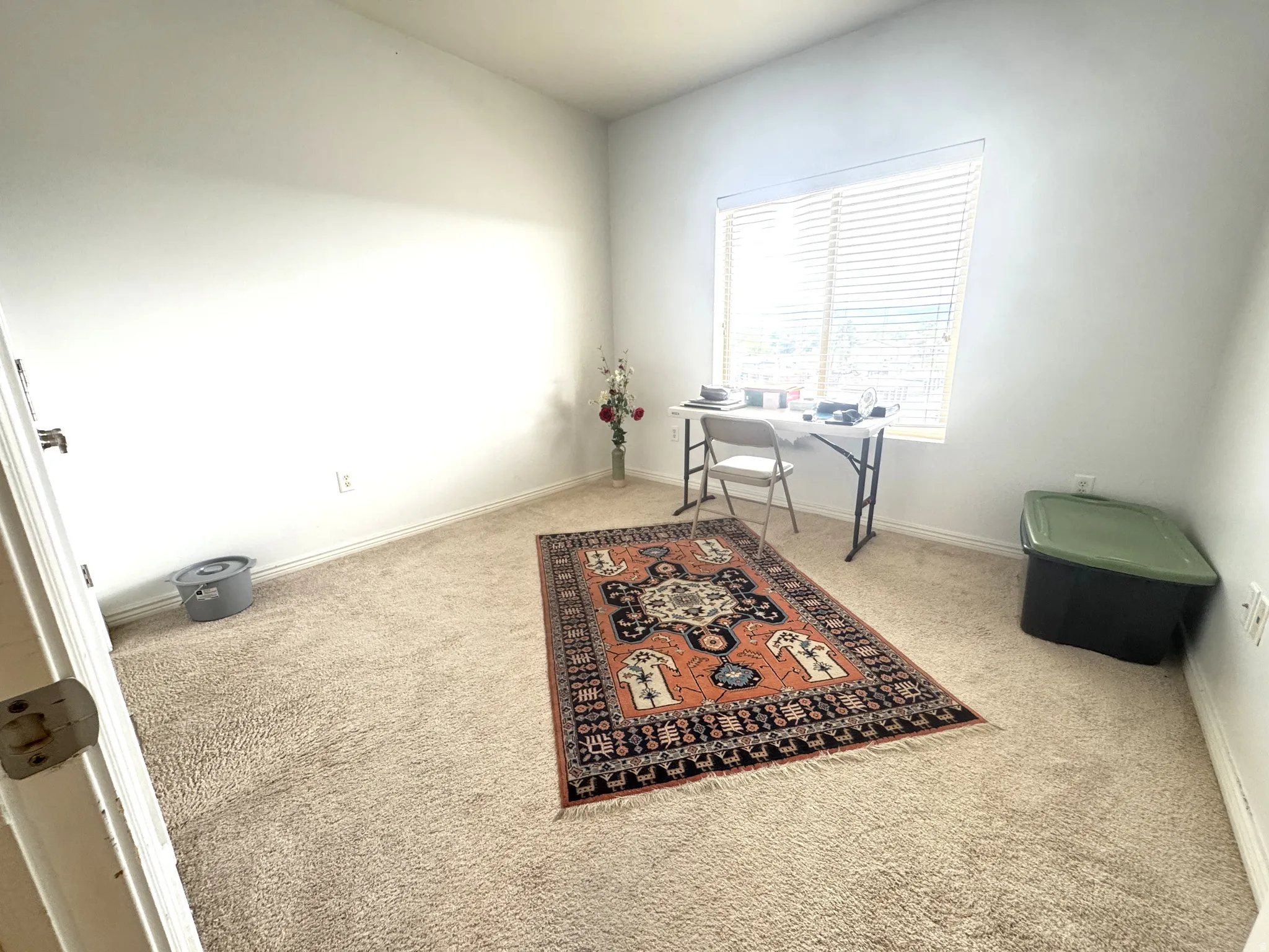 Office area with light colored carpet