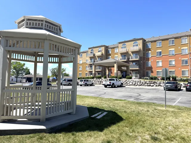 Surrounding community with uncovered parking and a gazebo