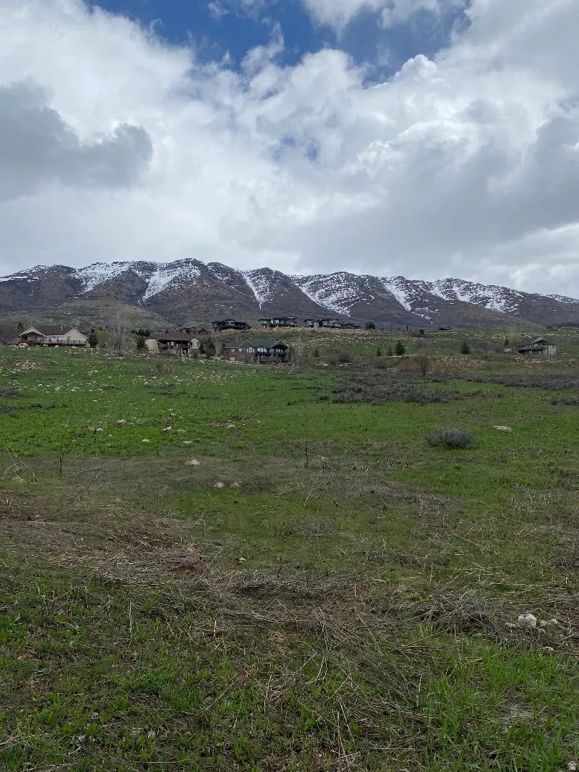 View of mountain background featuring rural landscape