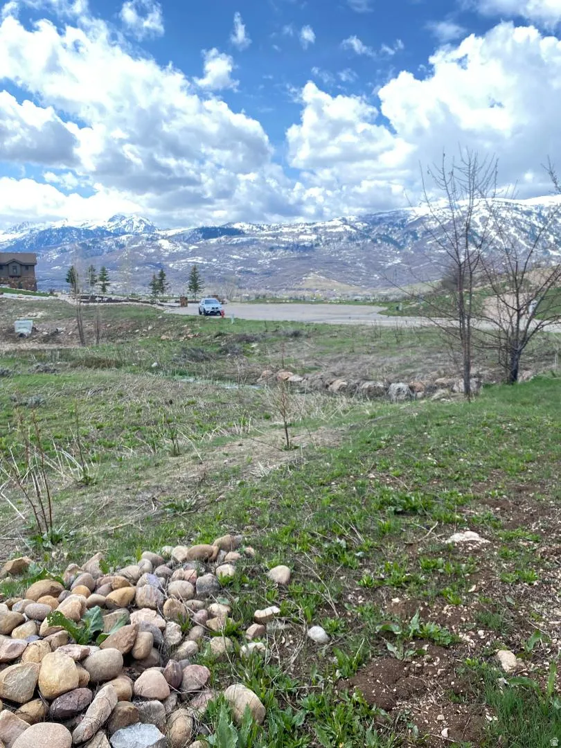 View of mountain backdrop with rural landscape