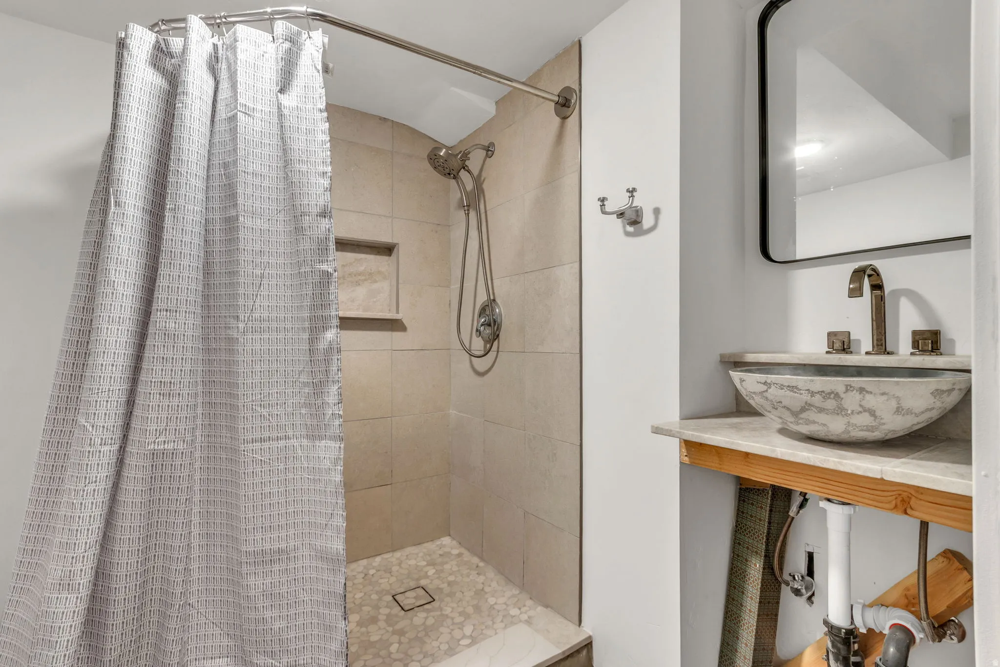Full bathroom featuring vanity and a shower stall