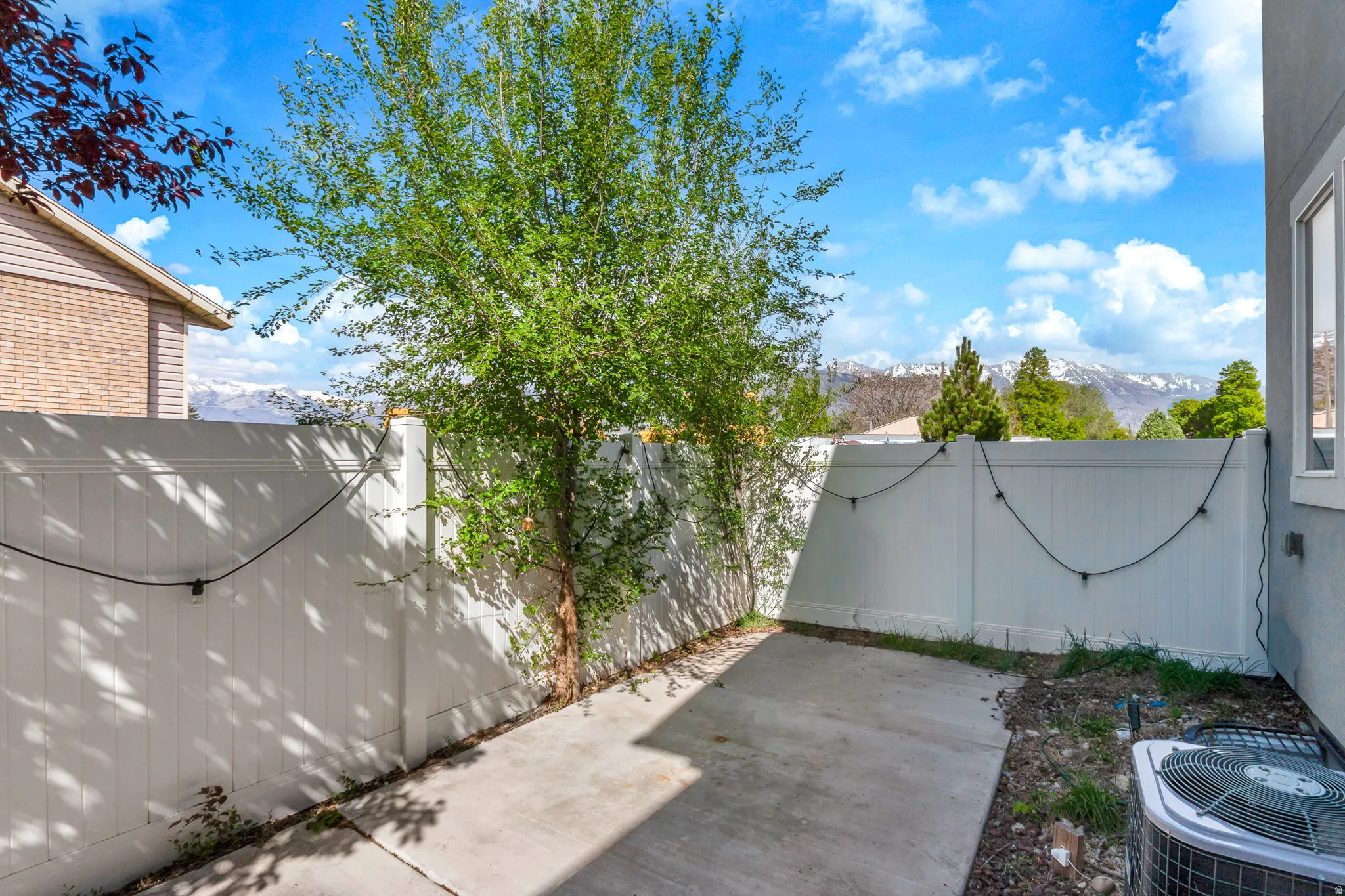 Fenced backyard with a mountain view