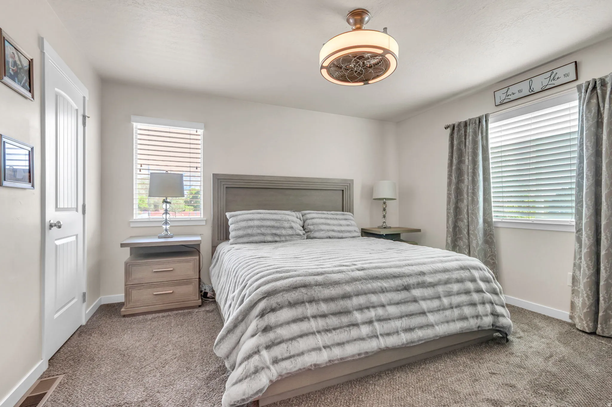 Bedroom with carpet floors and a ceiling fan