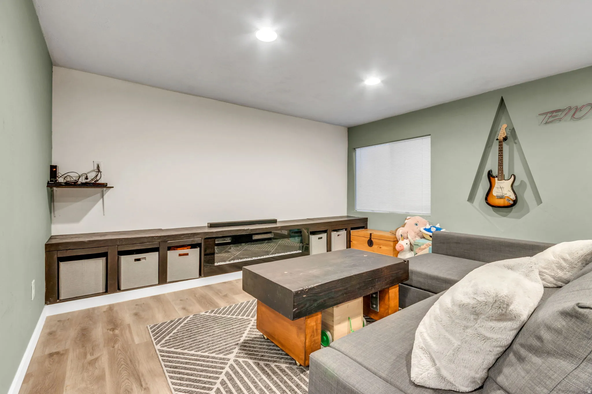 Living room featuring light wood-type flooring and recessed lighting