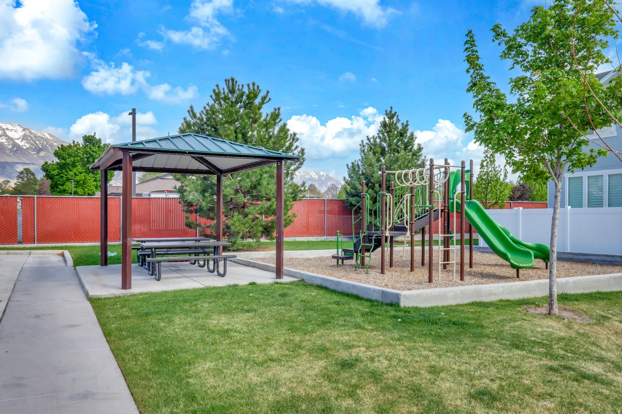 Community play area featuring a gazebo and a mountain view