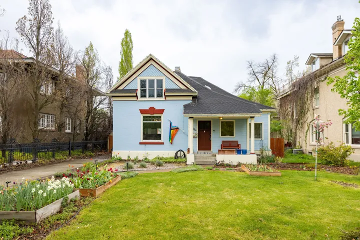 View of front of house with a garden and a porch
