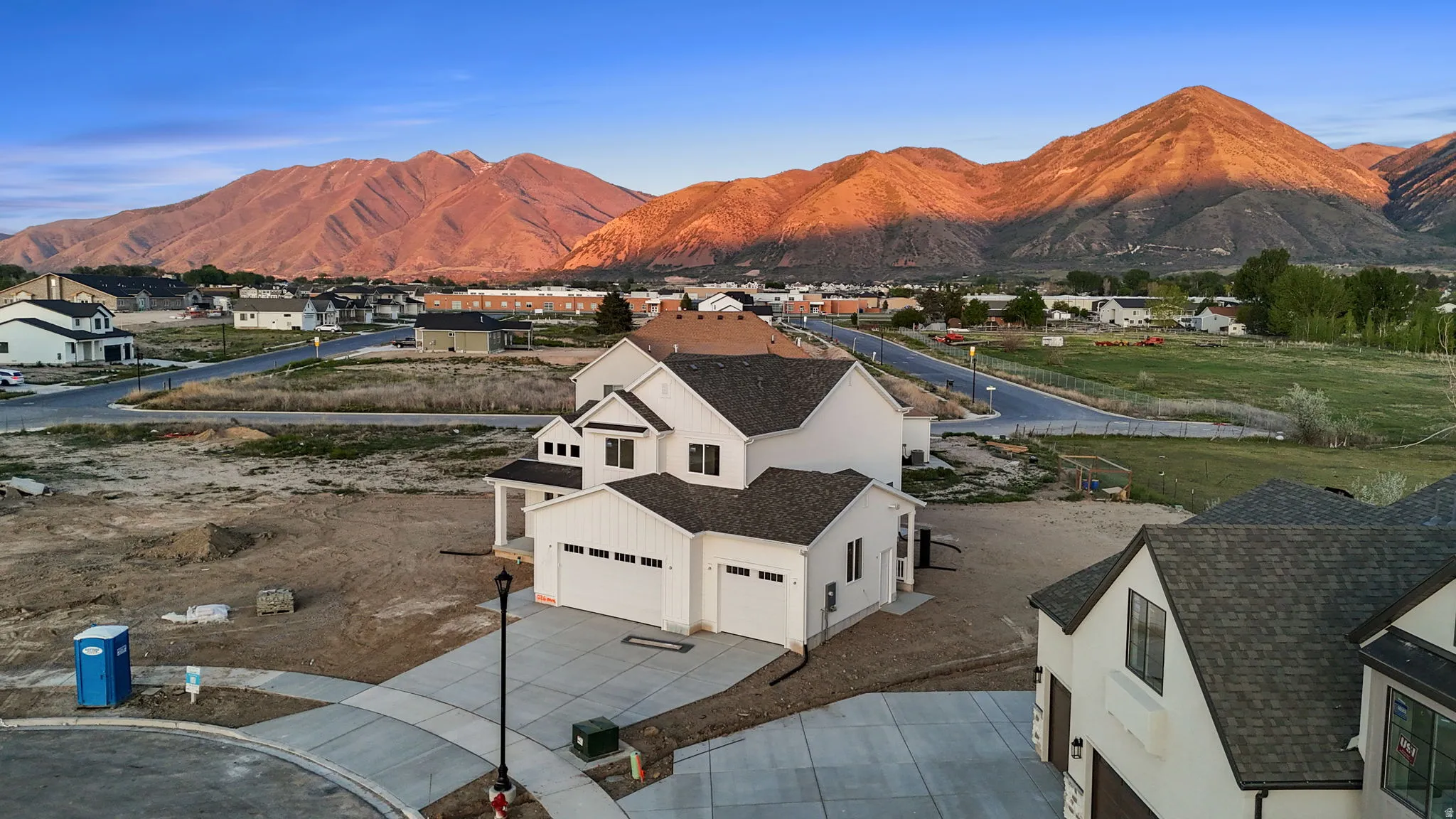 View of mountain background featuring nearby suburban area
