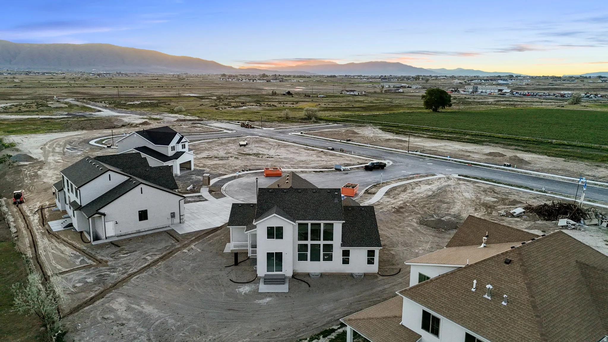 Aerial view at dusk of a mountain view and a residential view