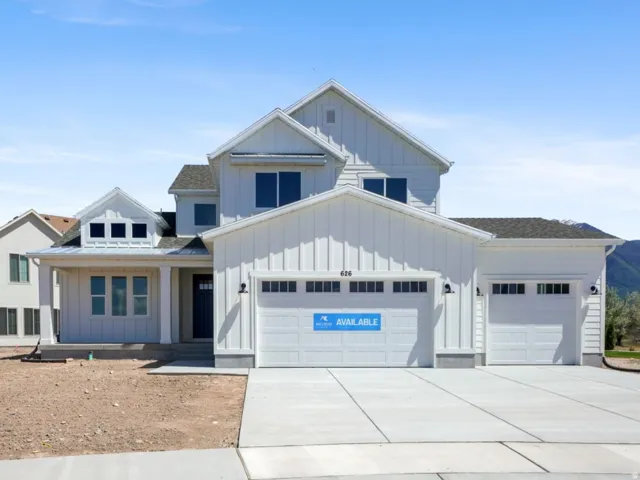 Modern farmhouse-style residence featuring white board-and-batten siding