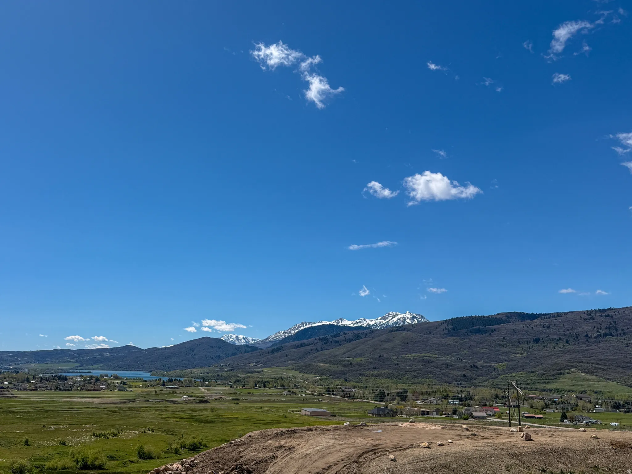 View of mountain backdrop featuring rural landscape