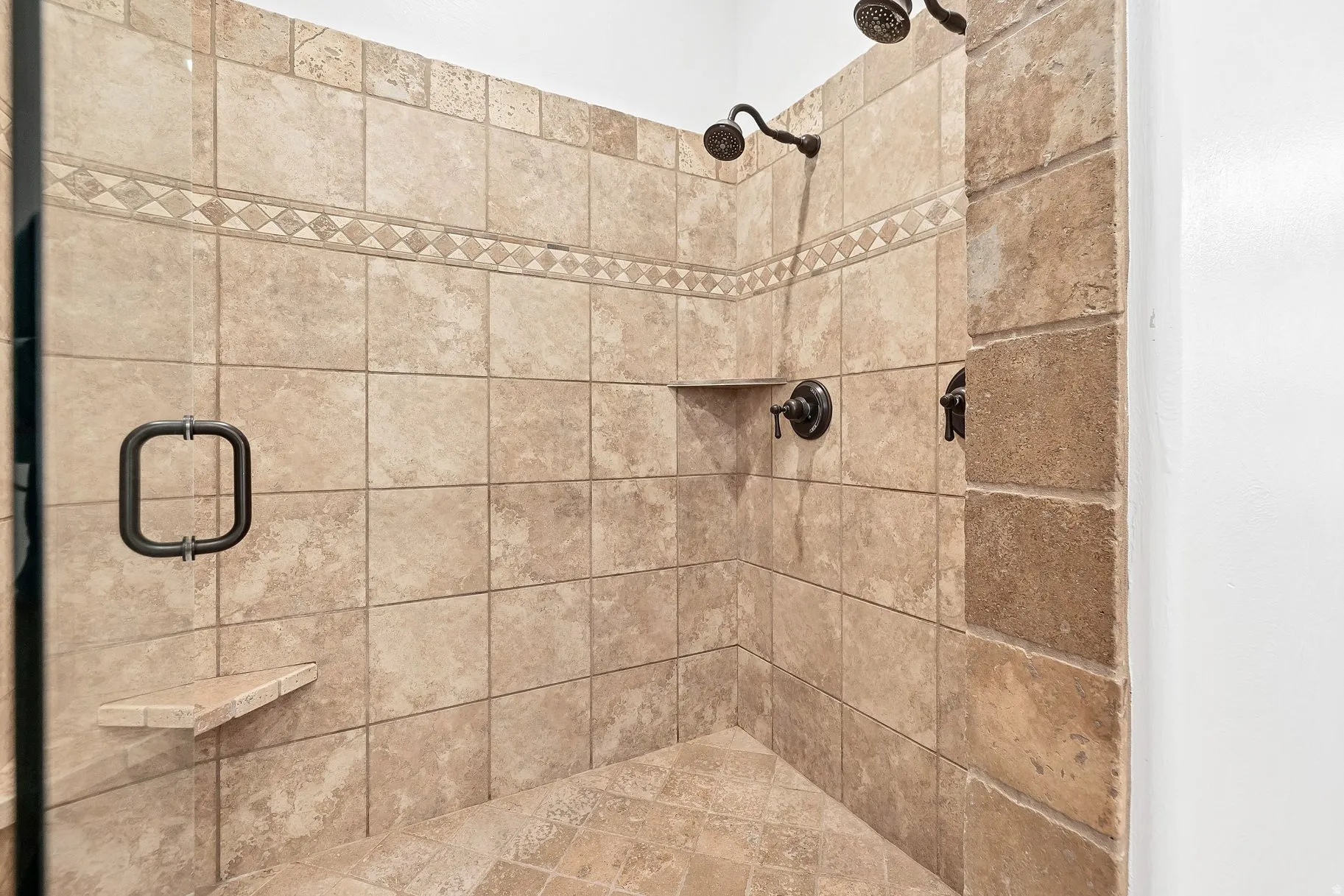 Full bath with a shower stall