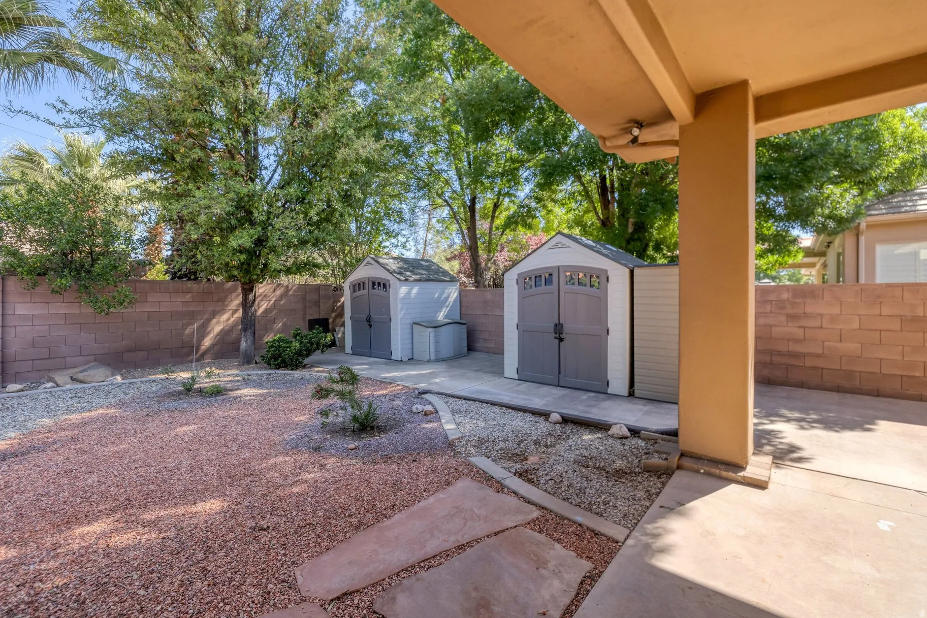 Fenced backyard with a shed
