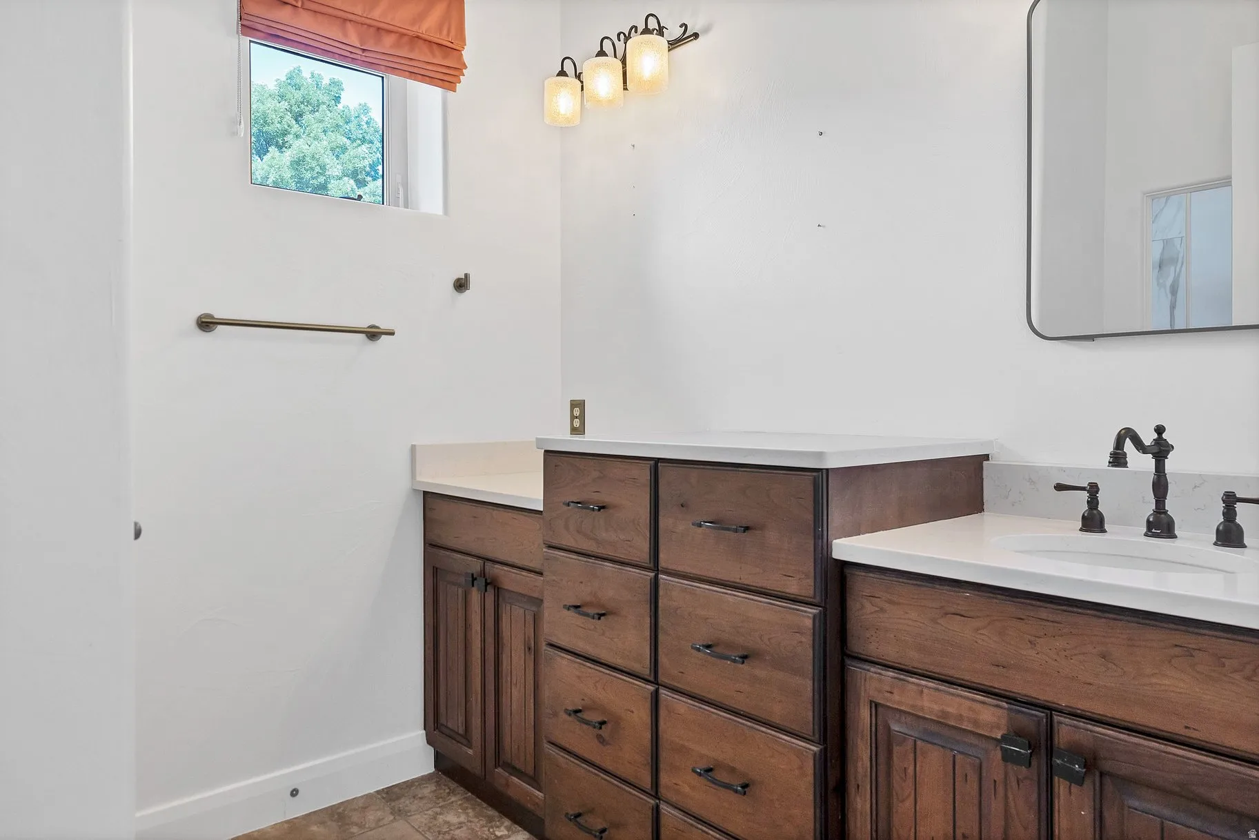 Full bathroom featuring vanity and baseboards