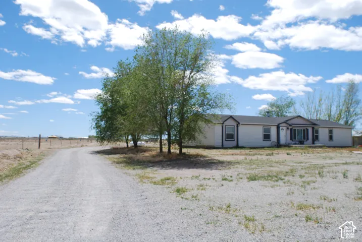 View of front of home with a rural view