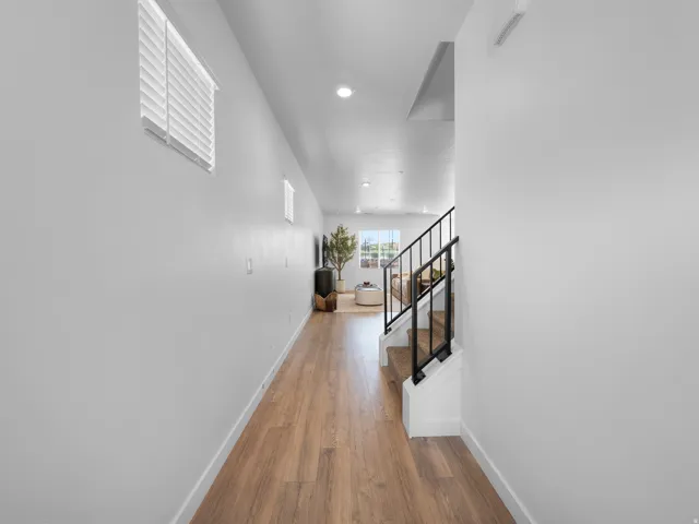 Wood-finish flooring throughout, with flush-mounted ceiling lighting