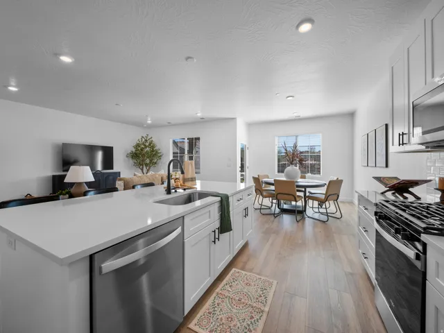 Kitchen island with an undermount sink and stainless steel dishwasher