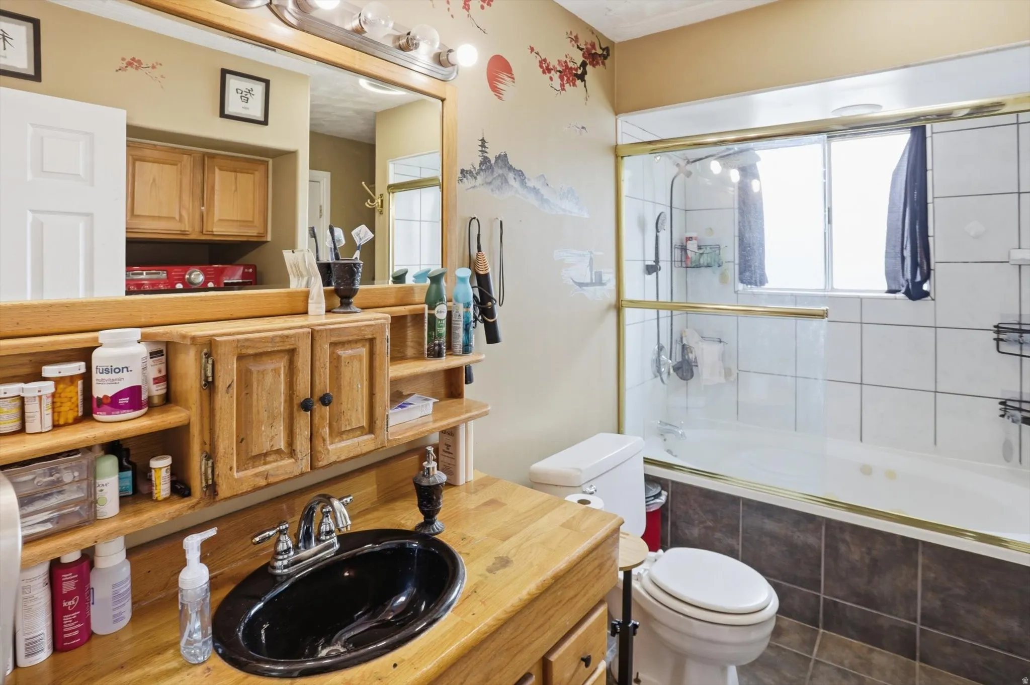 Full bath featuring vanity and tiled shower / bath combo