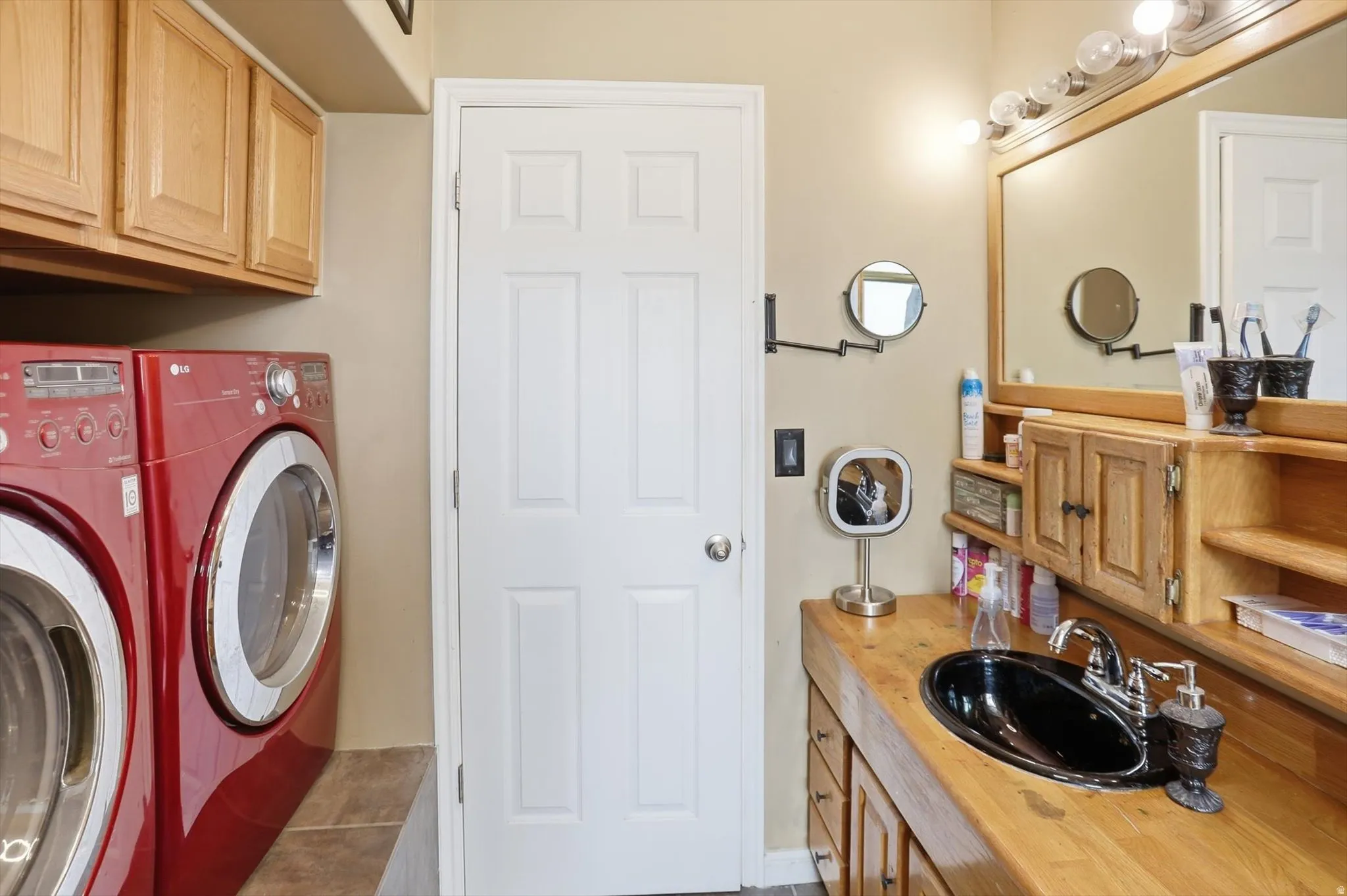 Bathroom with vanity and separate washer and dryer