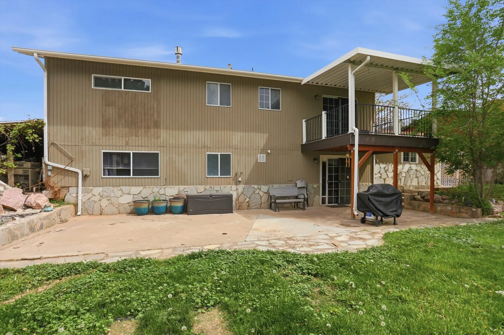 Back of property with a patio area.