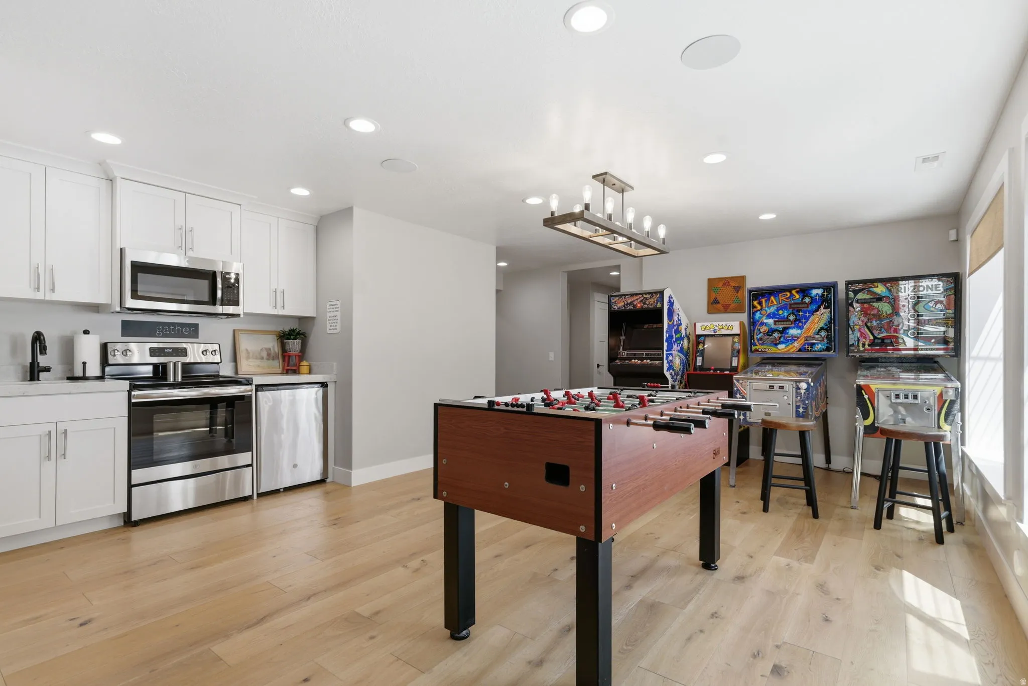 Playroom featuring light wood-style flooring and recessed lighting