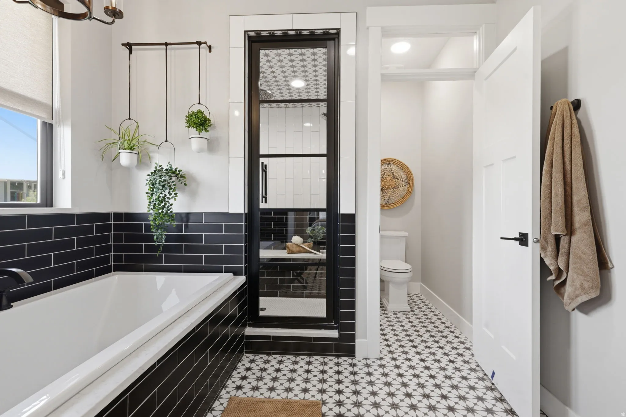 Bathroom with a garden tub and a shower stall