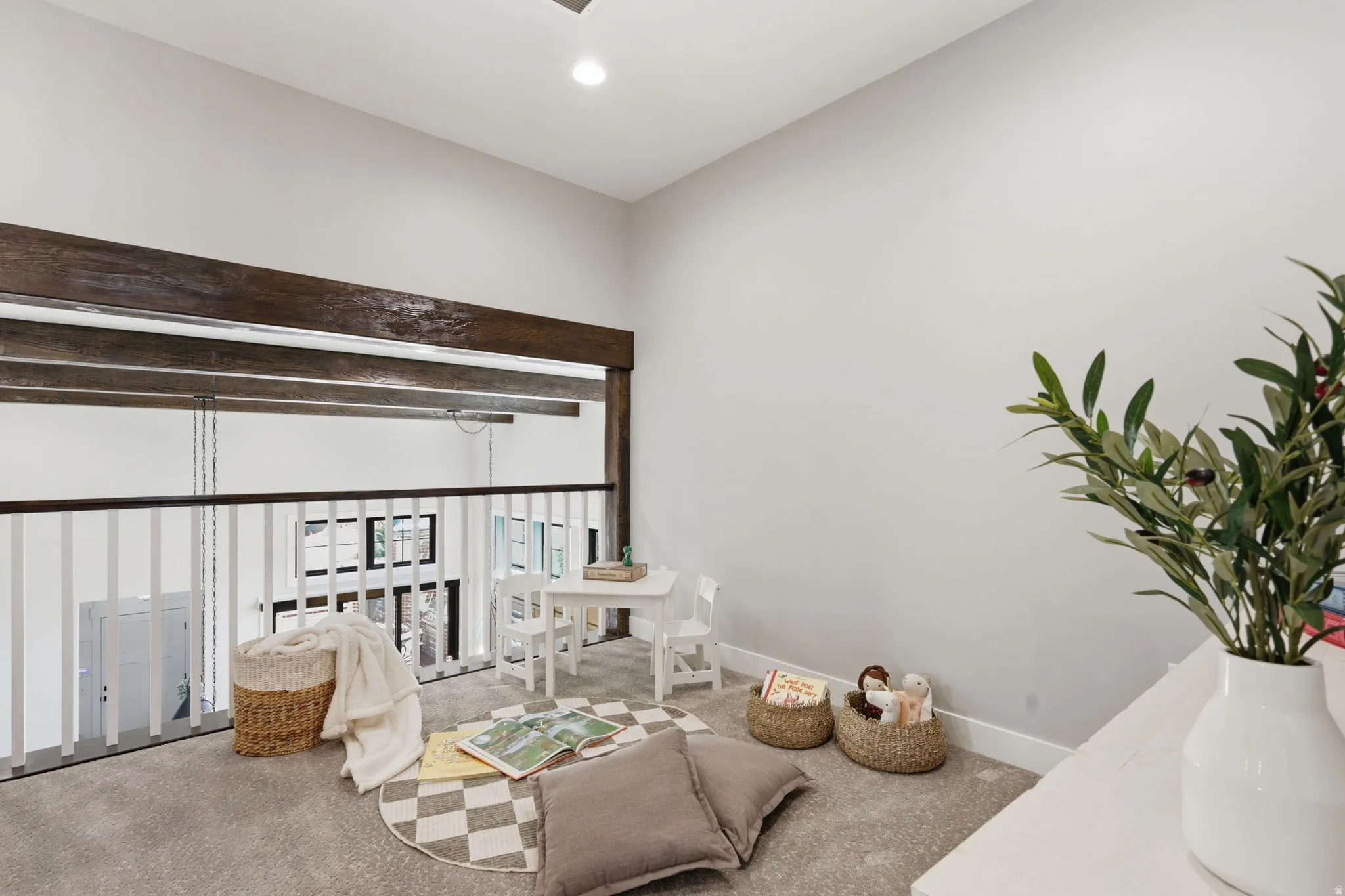Sitting room featuring carpet, a high ceiling, and recessed lighting