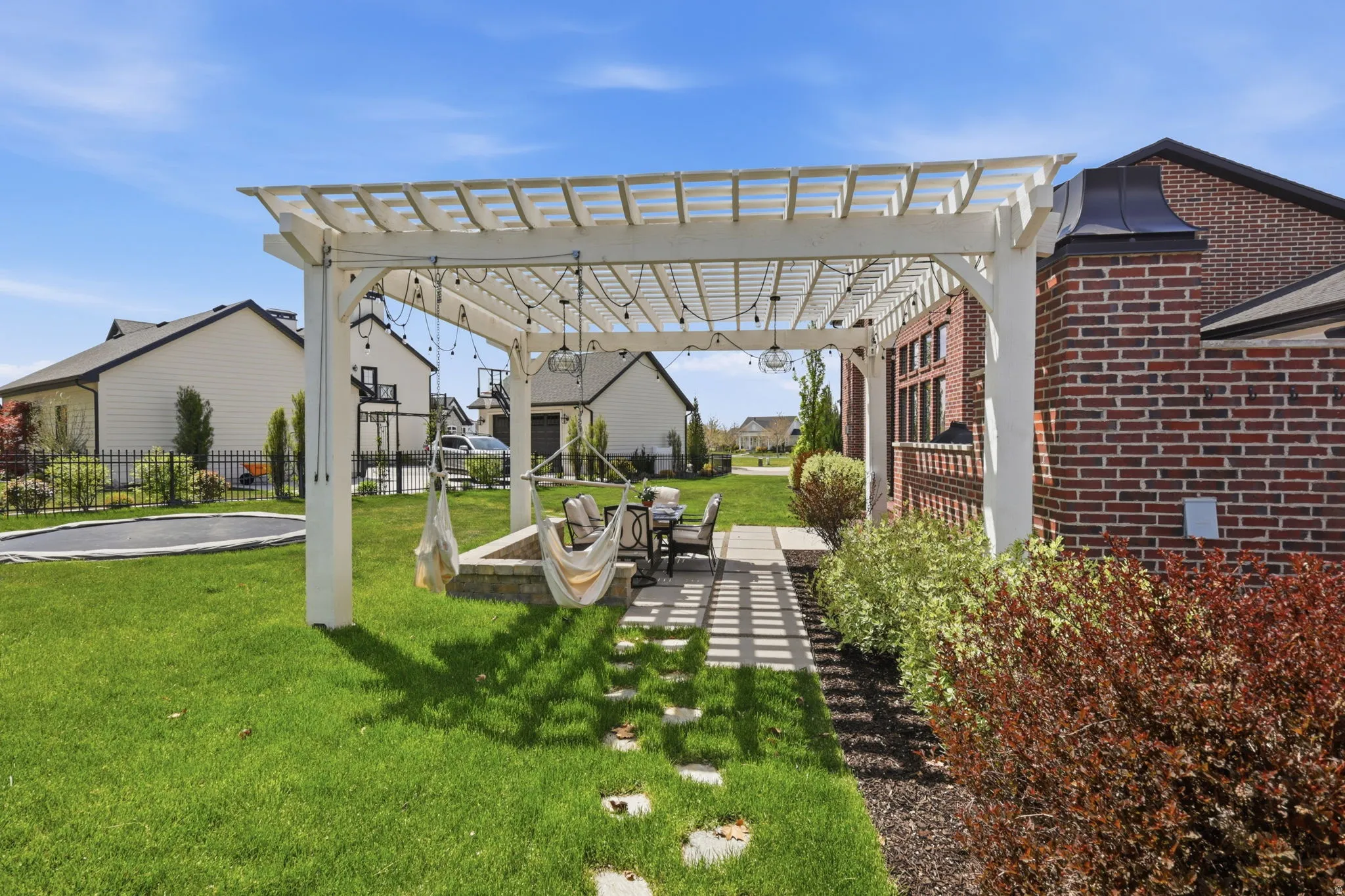 View of yard with a pergola and a patio area