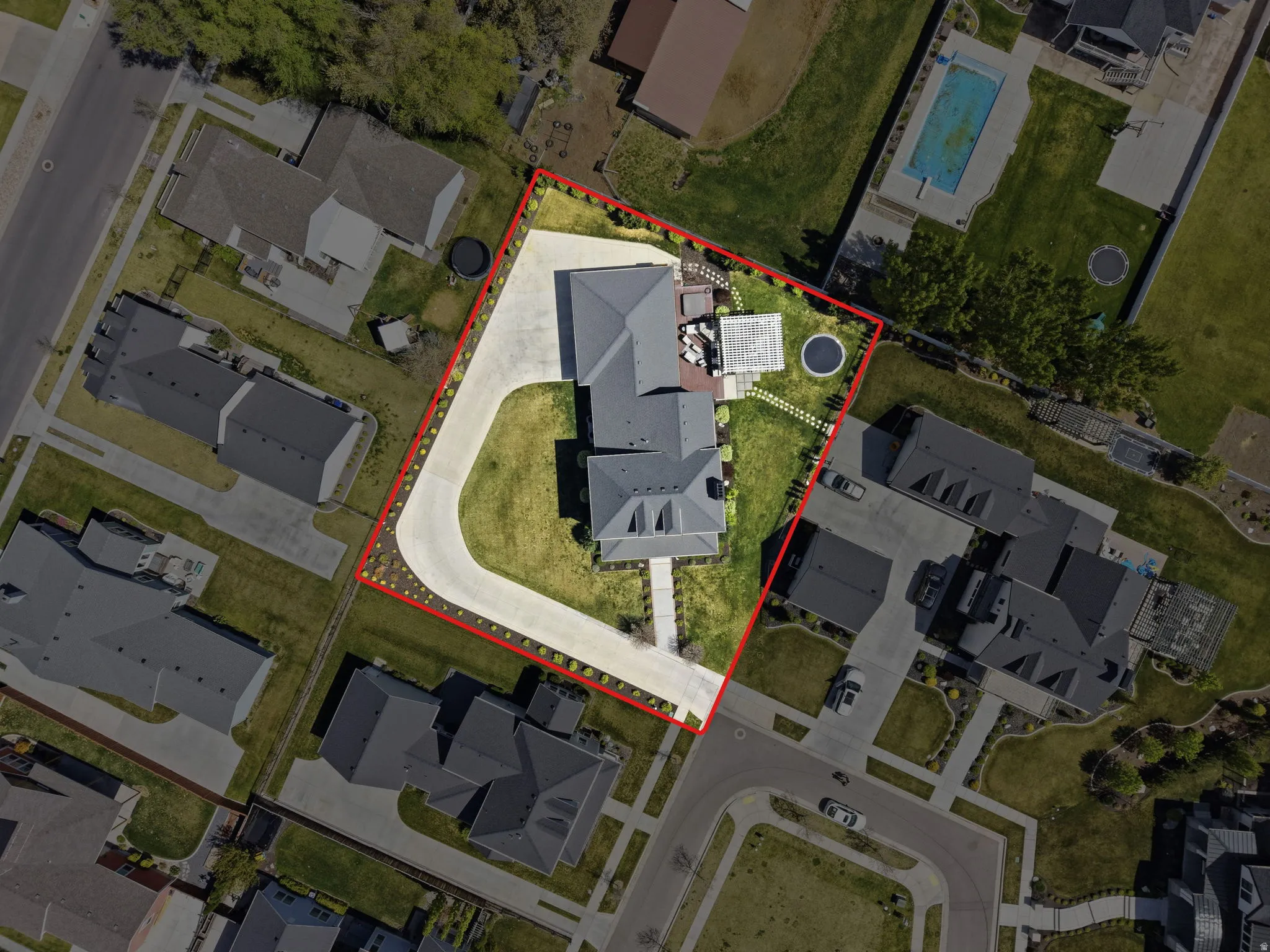 Aerial perspective of suburban area with property parcel outlined