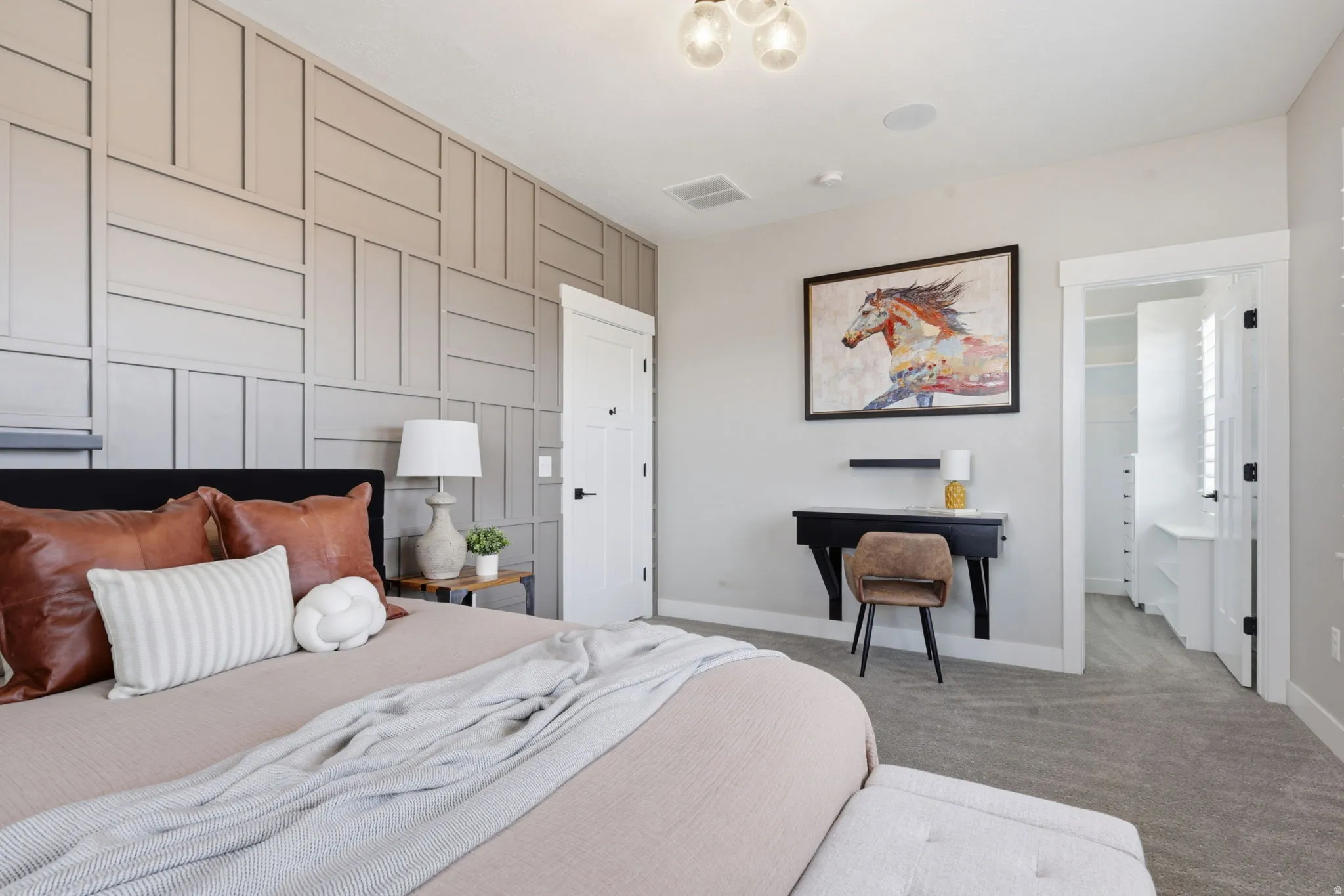 Carpeted bedroom with baseboards