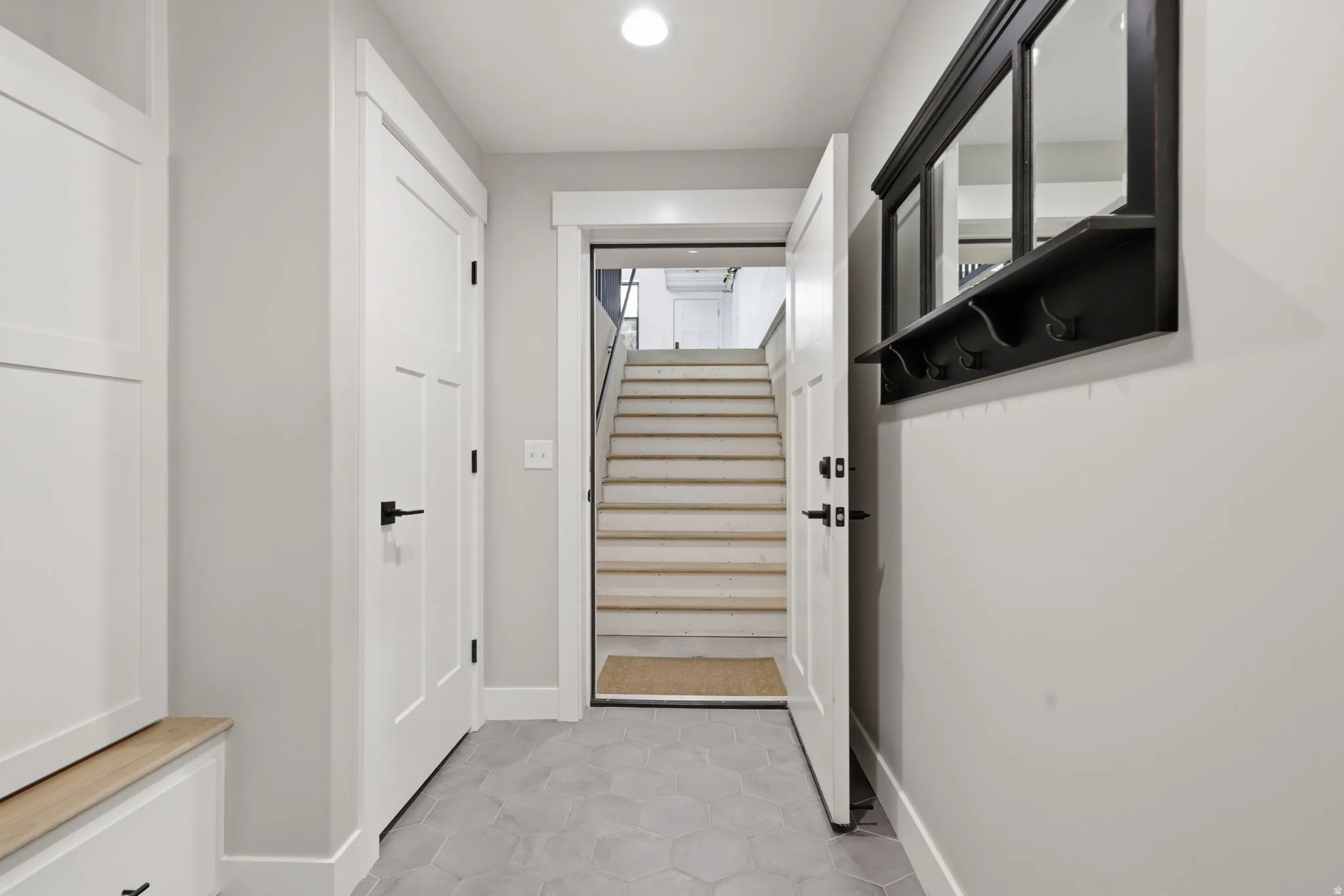 Entryway with stairway and recessed lighting