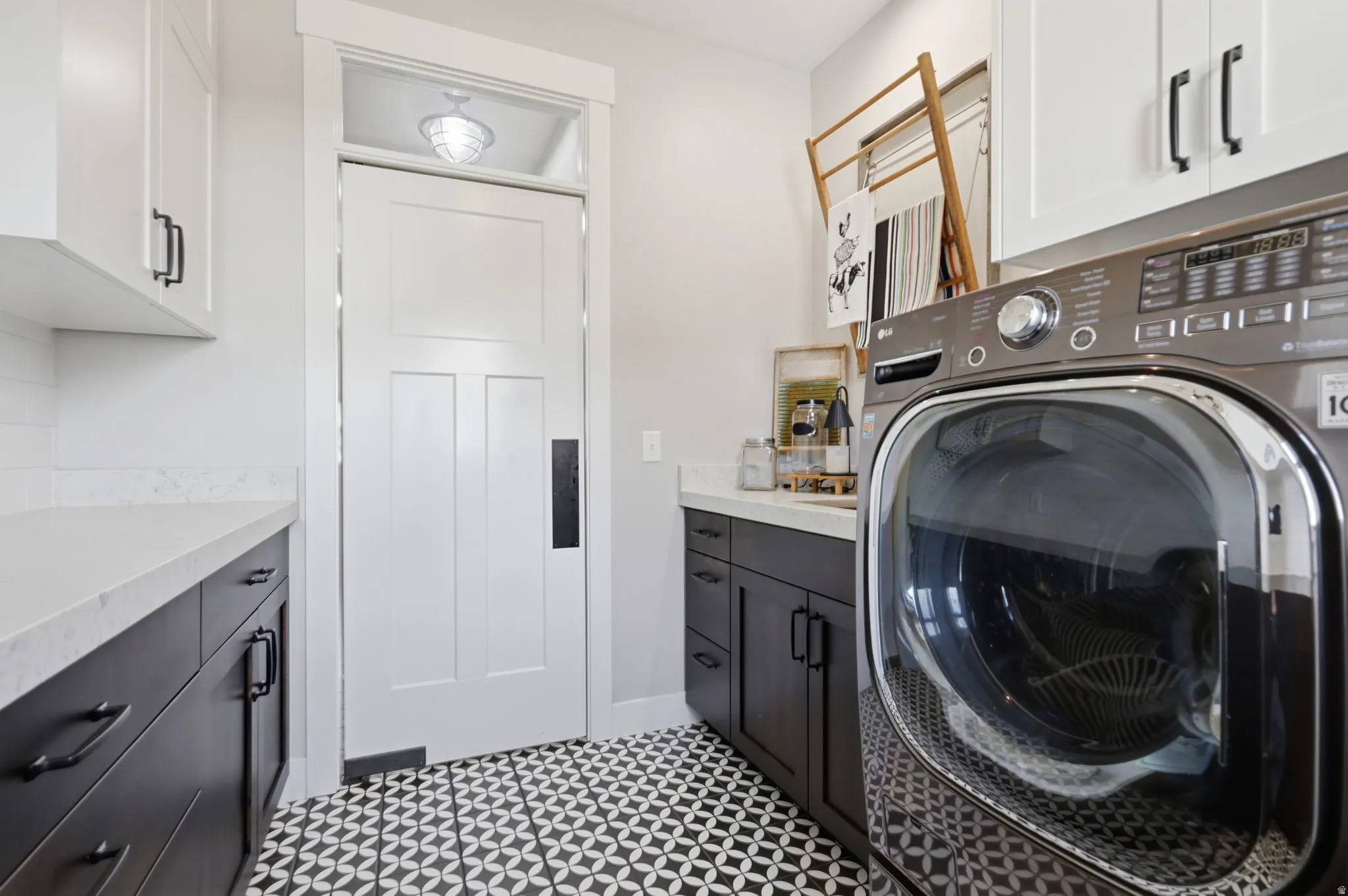 Laundry room with cabinet space and washer / clothes dryer