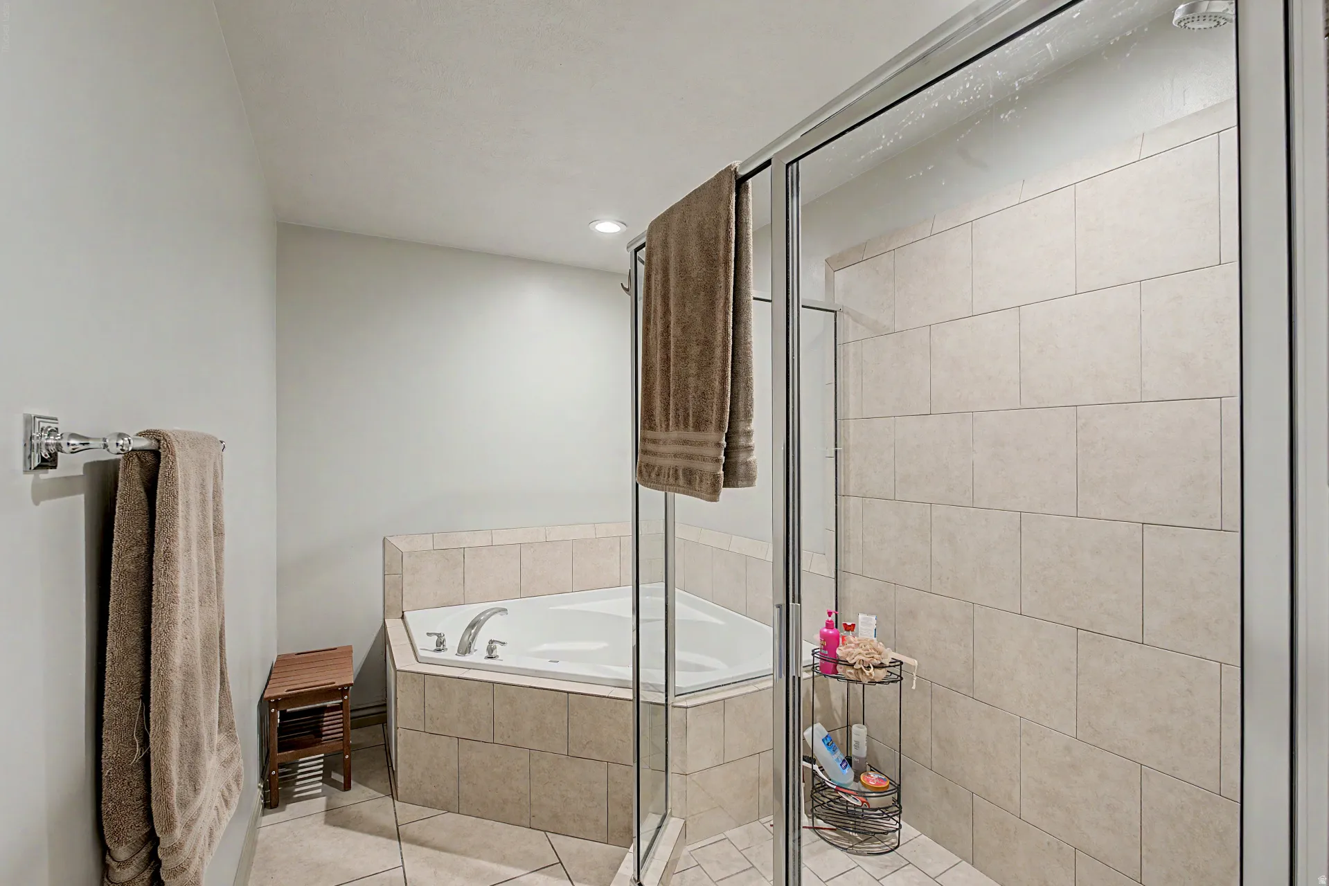 Full bath featuring a bathtub and separate shower, a bath, light tile patterned floors, and recessed lighting