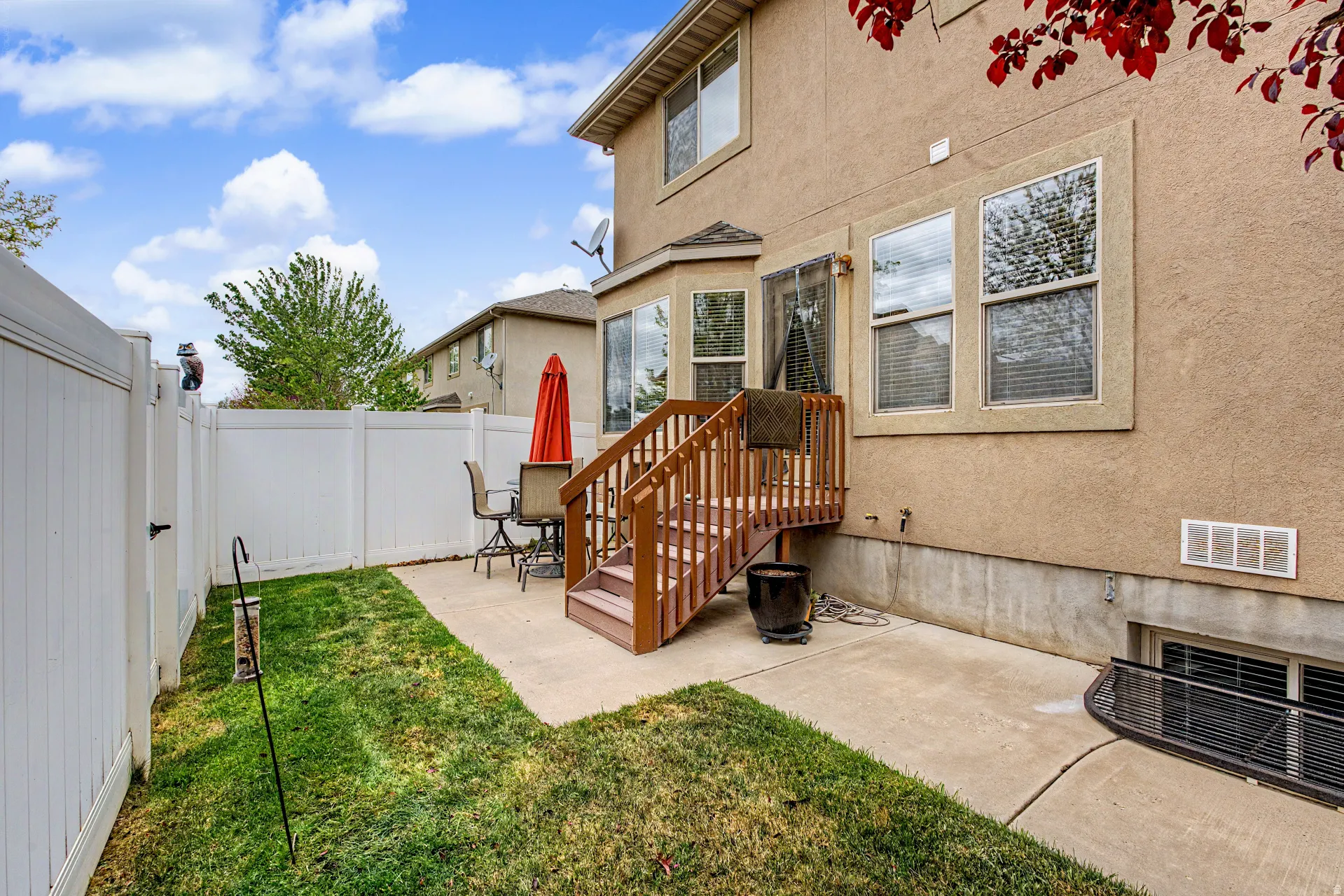 Rear view of house featuring a patio and fenced backyard