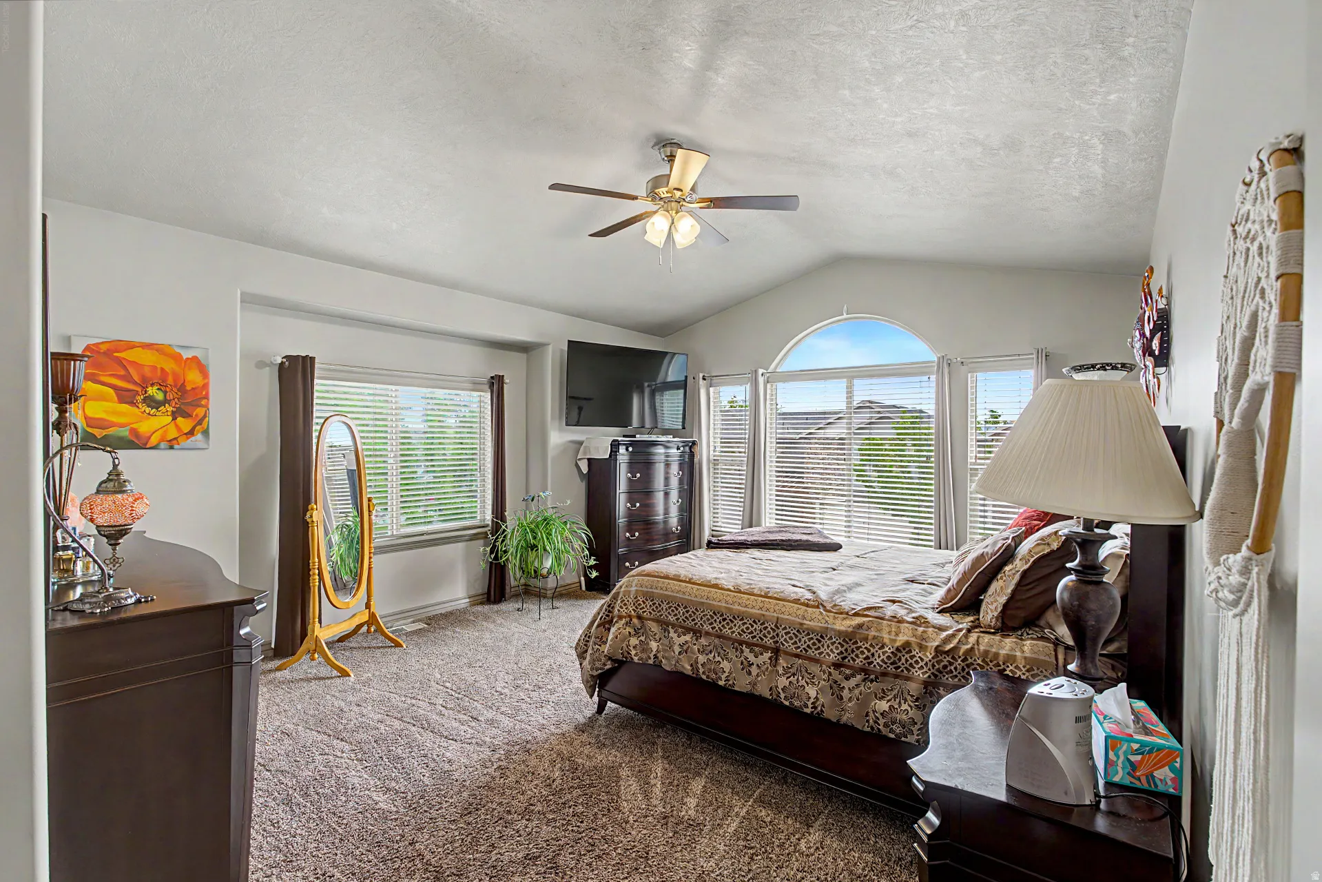Primary Bedroom featuring carpet floors, ceiling fan, and