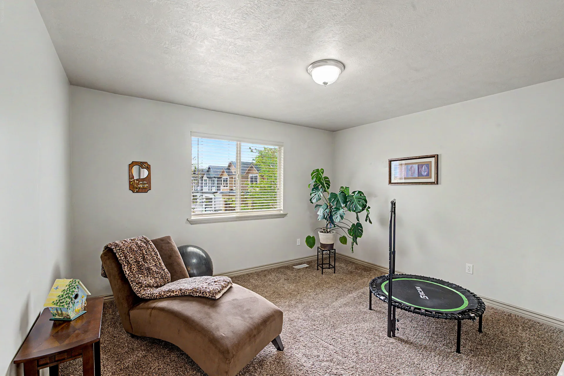 Bedroom room featuring carpet and natural light