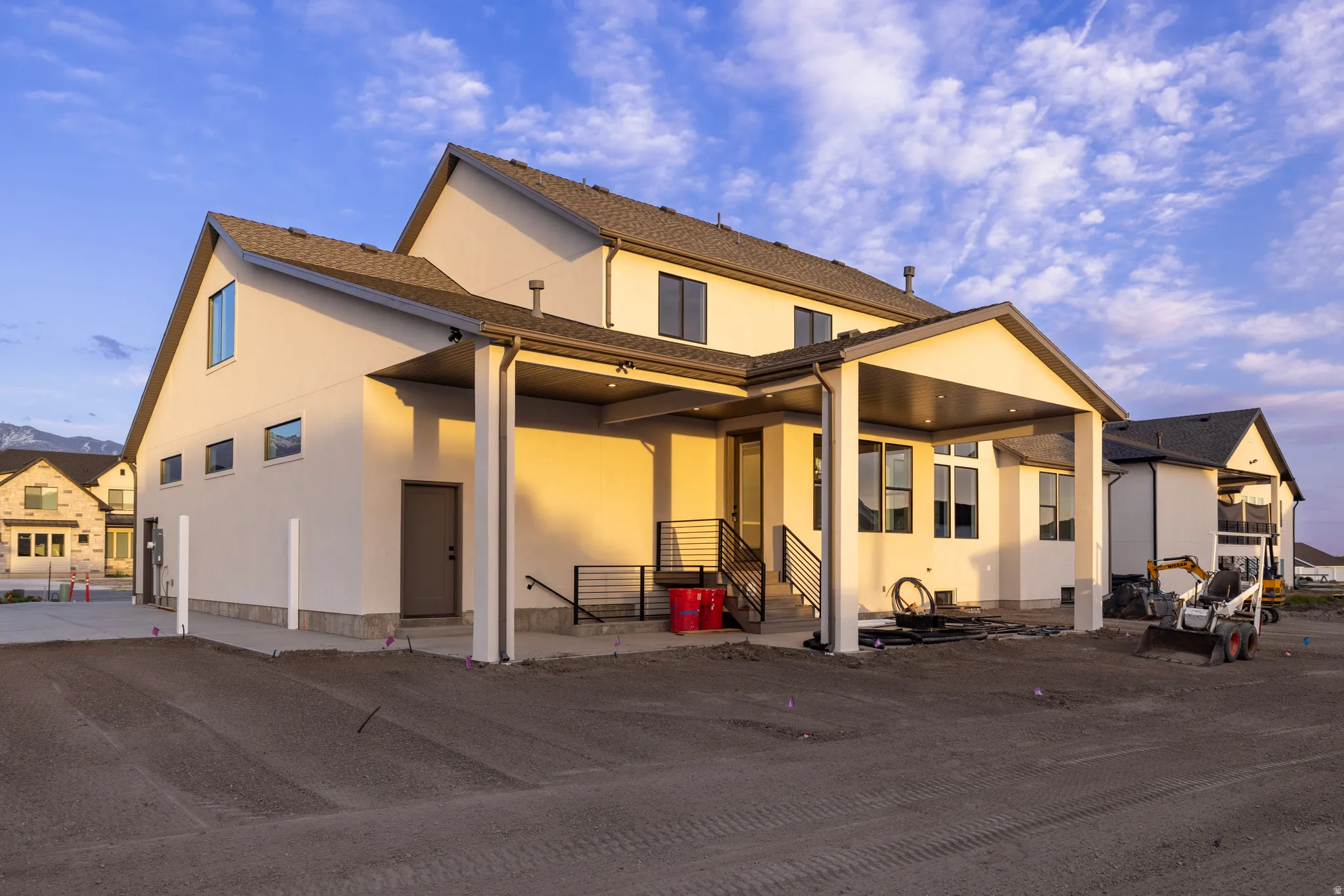 Rear view of house with stucco siding