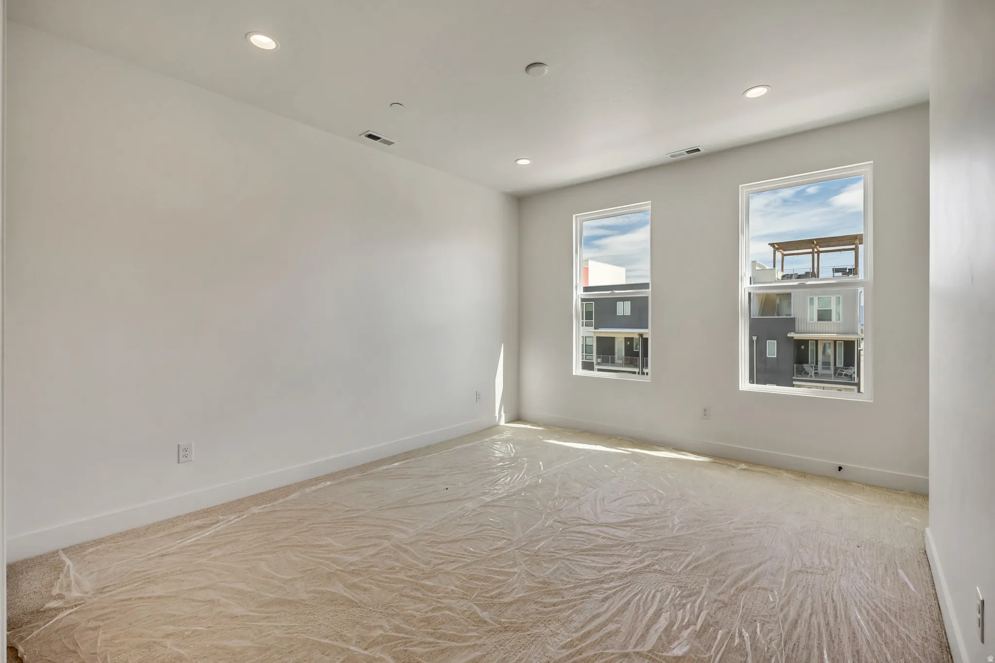Unfurnished room with baseboards and recessed lighting