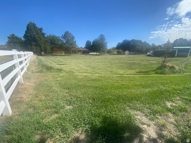 Beautiful 1/2 acre lot with flat buildable terrain