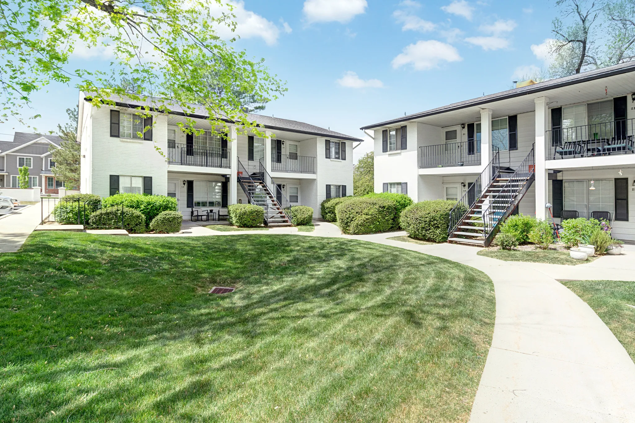 View of apartment building / complex featuring stairs