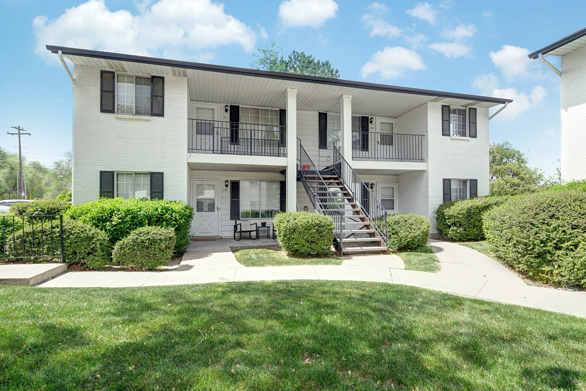 View of apartment building / complex with stairs