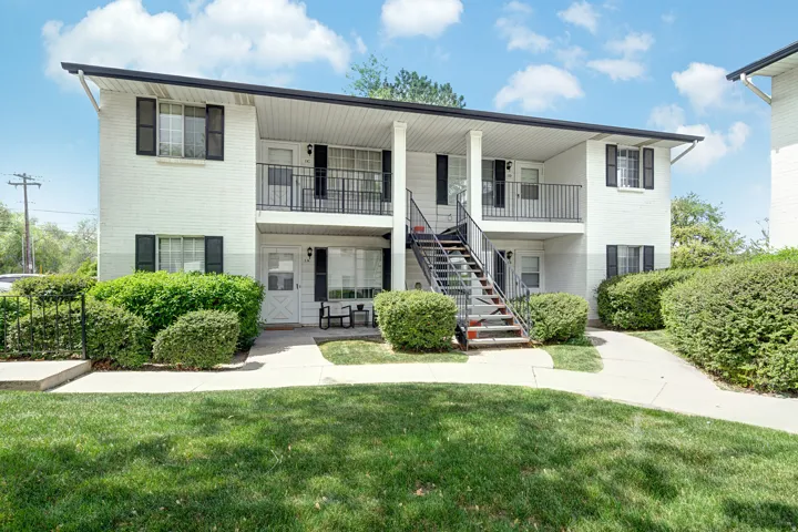 View of apartment building / complex with stairway