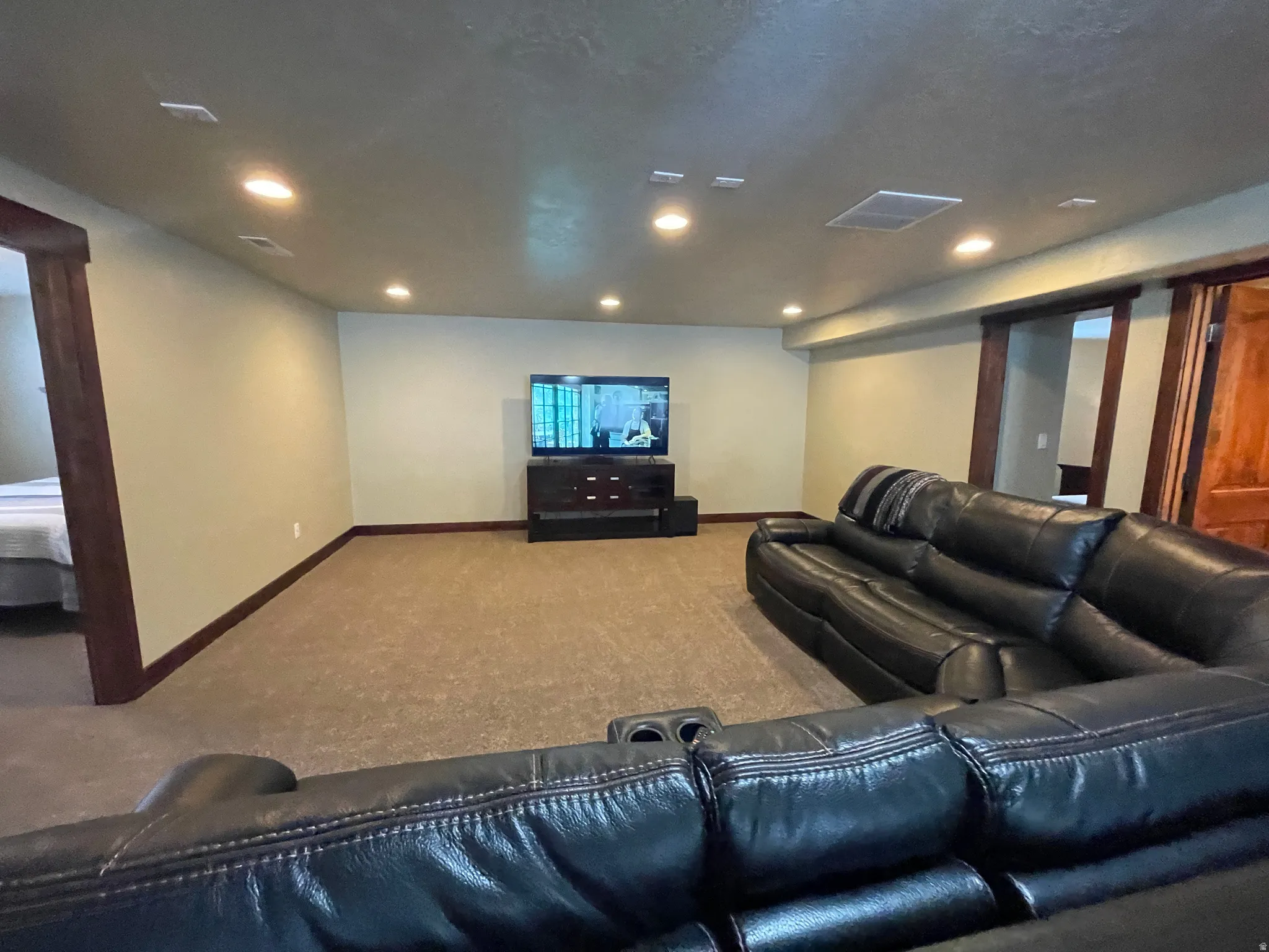 Cinema featuring carpet flooring and recessed lighting